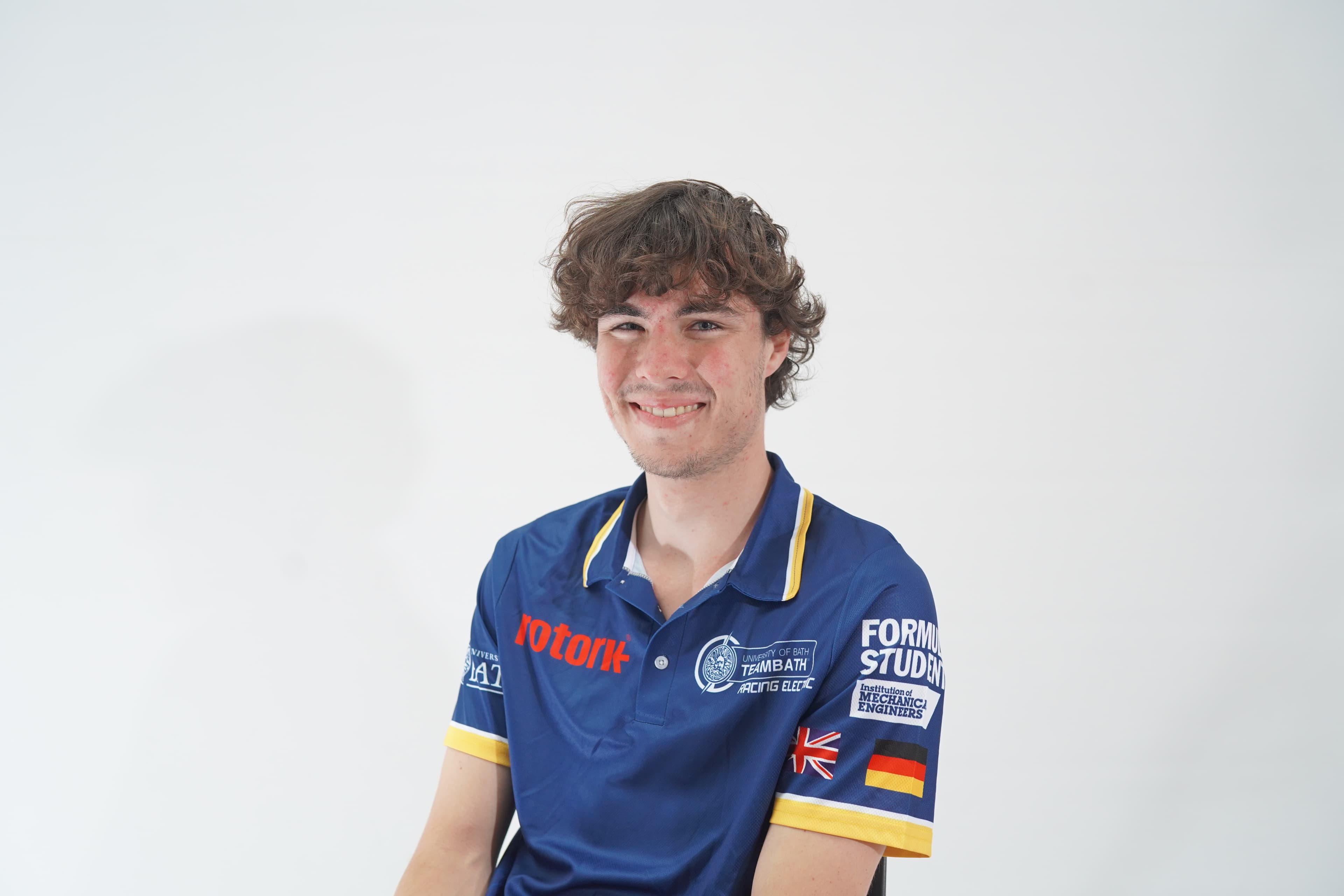 Portrait wearing a blue and yellow Team Bath Racing Electric shirt