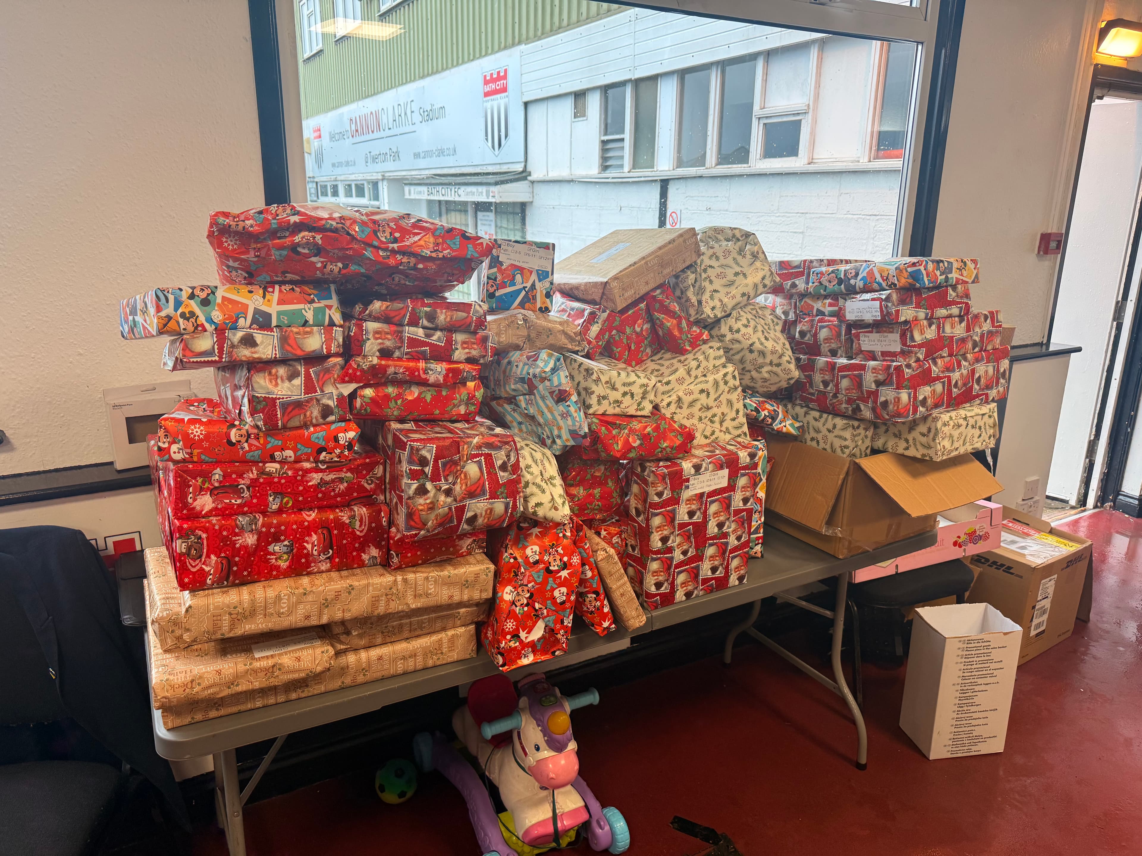 Stacks of wrapped Christmas presents ready for children in Ukraine